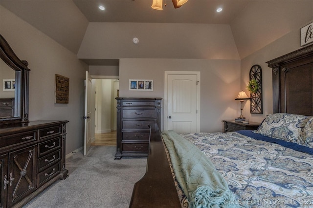 bedroom with lofted ceiling, light carpet, and ceiling fan