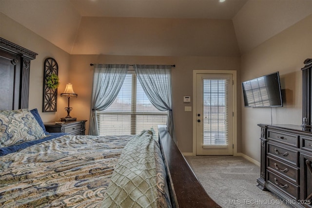 bedroom with lofted ceiling, light colored carpet, access to exterior, and multiple windows