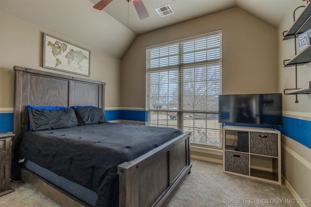 bedroom featuring ceiling fan, light colored carpet, and vaulted ceiling