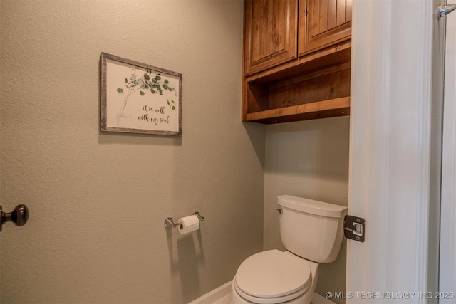 bathroom featuring toilet