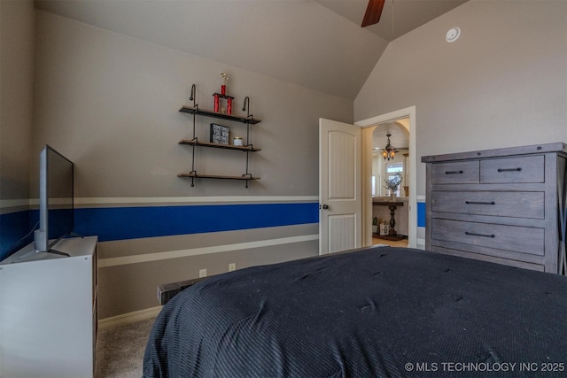 unfurnished bedroom featuring vaulted ceiling, ceiling fan, and carpet flooring