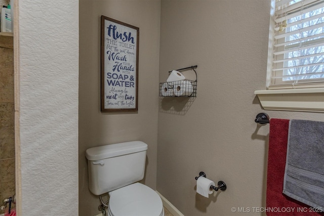 bathroom featuring toilet