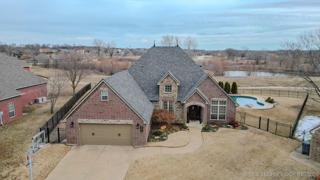 view of front facade with a front lawn and a garage