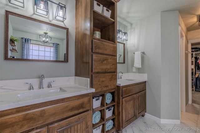 bathroom with vanity and a chandelier