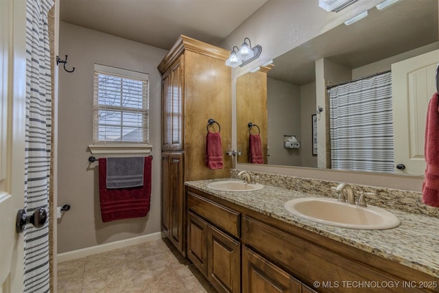 bathroom with vanity and tile patterned floors