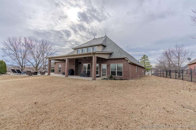 rear view of house with a patio