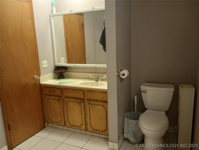 bathroom featuring tile patterned floors, vanity, and toilet