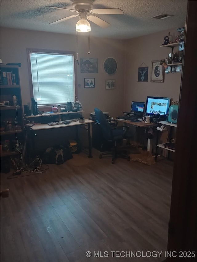 office with a textured ceiling, ceiling fan, and hardwood / wood-style flooring