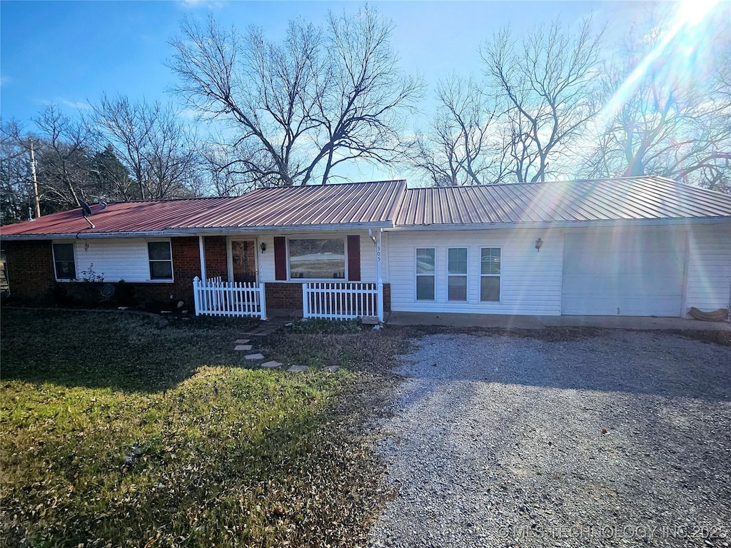 single story home with a garage