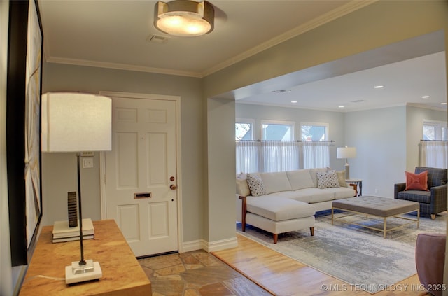 living room featuring ornamental molding and light hardwood / wood-style floors