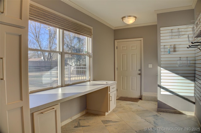 doorway to outside with crown molding