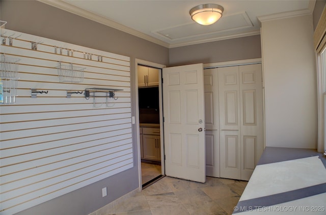 bedroom with a closet and crown molding