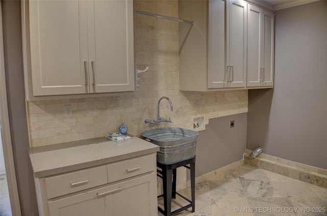 laundry area with washer hookup, cabinets, sink, and electric dryer hookup