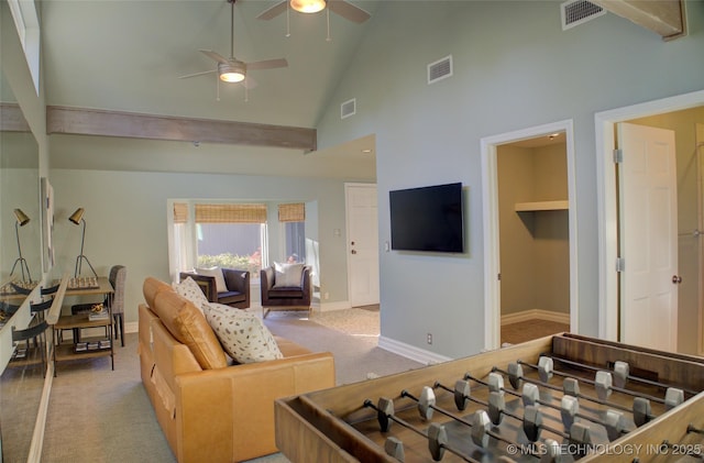 living room featuring high vaulted ceiling, light carpet, and ceiling fan