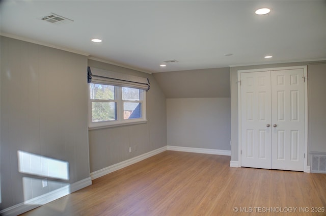 bonus room featuring light hardwood / wood-style floors and lofted ceiling