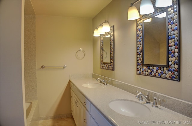 bathroom featuring a bathtub, tile patterned floors, and vanity