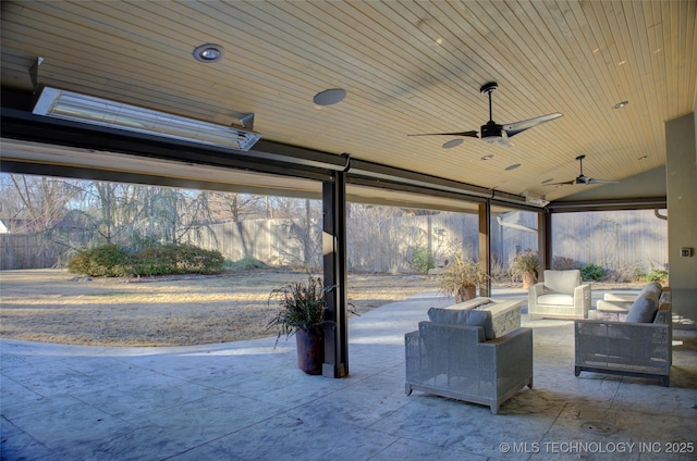 view of patio / terrace featuring ceiling fan and an outdoor living space