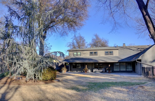 view of front of property featuring a patio