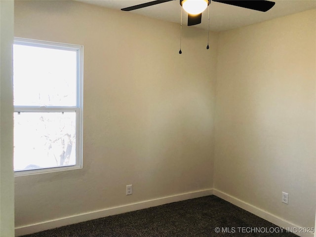 spare room featuring carpet floors and ceiling fan