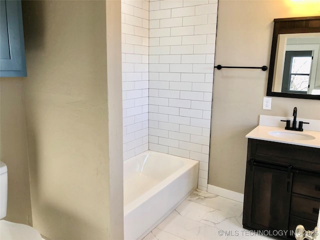 full bath featuring marble finish floor, vanity, toilet, and baseboards