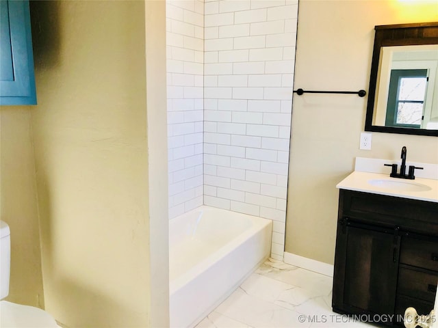 bathroom featuring marble finish floor, toilet, tub / shower combination, vanity, and baseboards