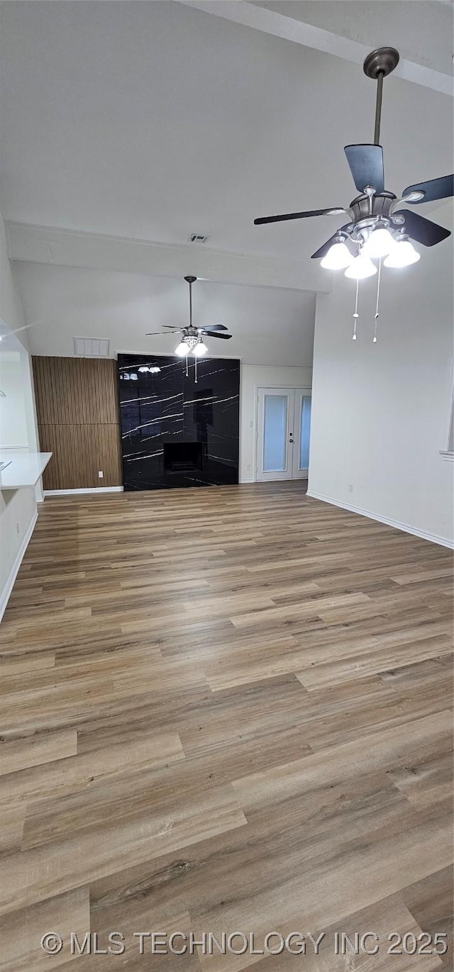 unfurnished living room with light hardwood / wood-style floors