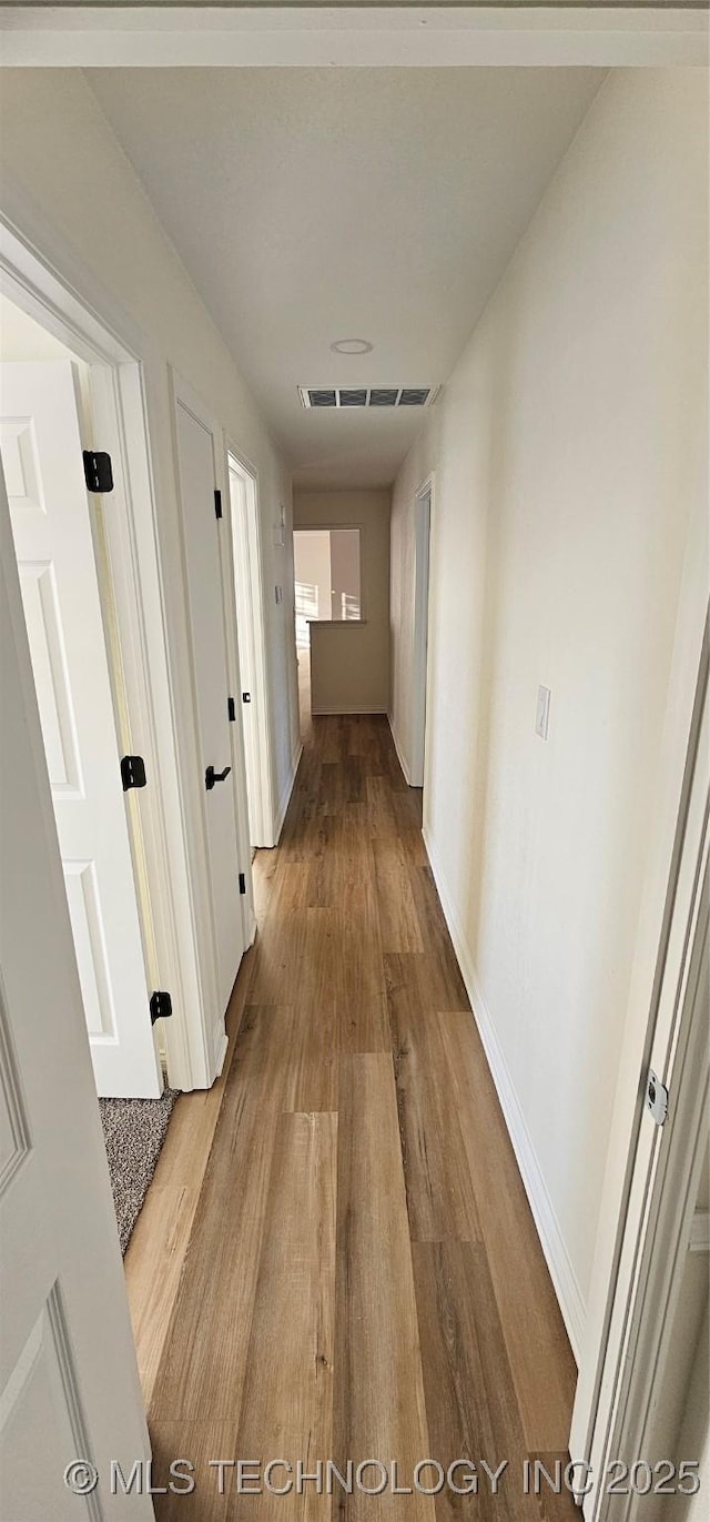 corridor featuring light hardwood / wood-style flooring