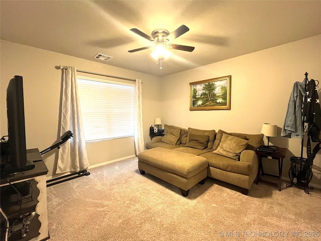 living room with ceiling fan and light colored carpet