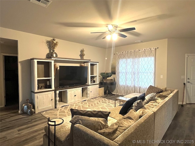 living room featuring wood-type flooring and ceiling fan