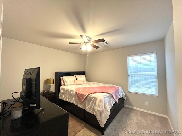 carpeted bedroom with ceiling fan