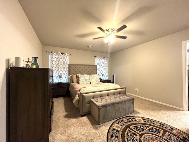 bedroom with light colored carpet and ceiling fan