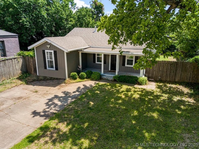 ranch-style home with covered porch and a front yard