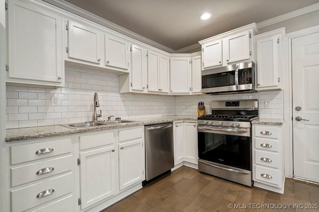 kitchen featuring white cabinets, light stone countertops, sink, and stainless steel appliances