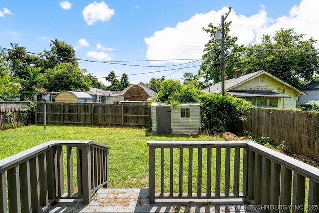 view of yard featuring a shed and a deck