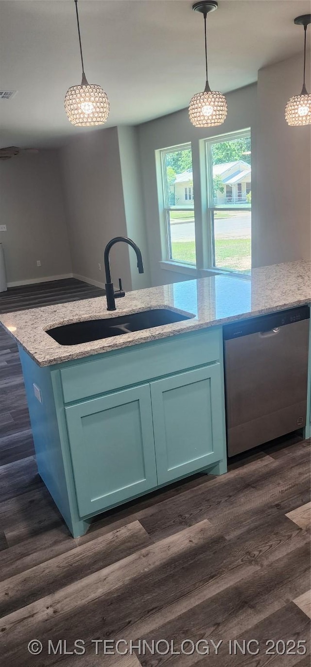 kitchen with decorative light fixtures, dishwasher, sink, and dark wood-type flooring