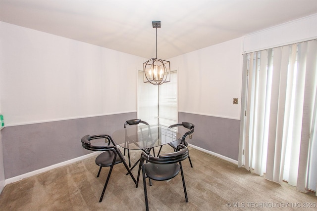 carpeted dining space featuring a notable chandelier