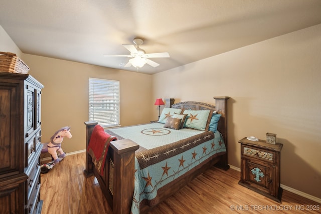 bedroom featuring ceiling fan and wood-type flooring