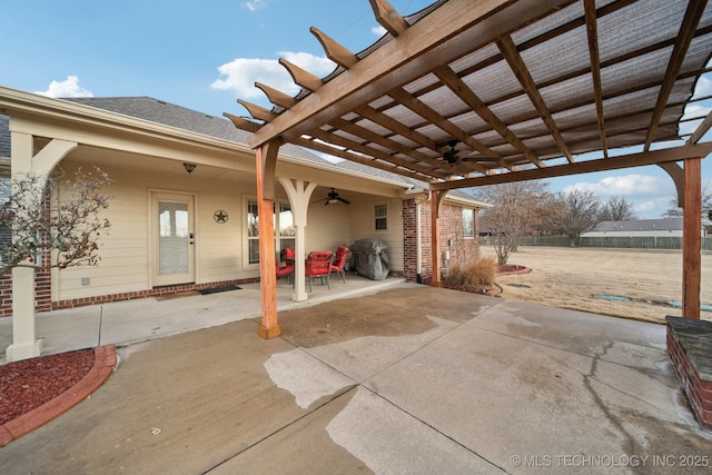 view of patio / terrace featuring a grill, ceiling fan, and a pergola