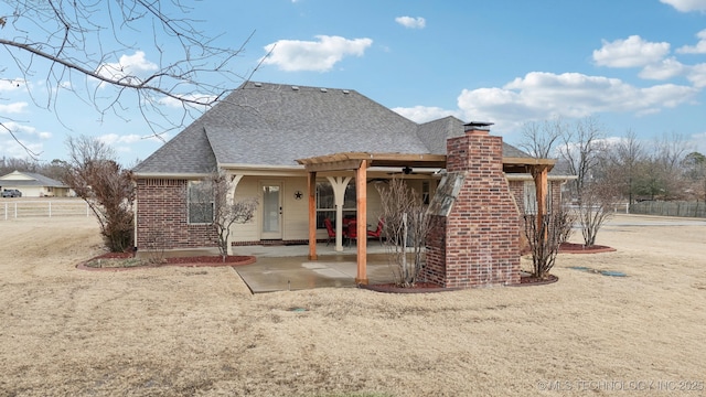 rear view of property with a patio area