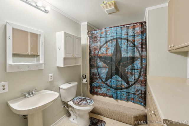 bathroom featuring a shower with curtain, ornamental molding, toilet, and sink