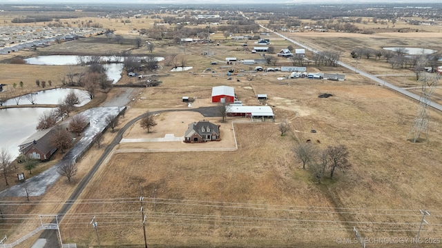 bird's eye view featuring a water view and a rural view