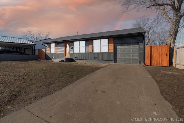 view of front of property featuring a garage and a yard