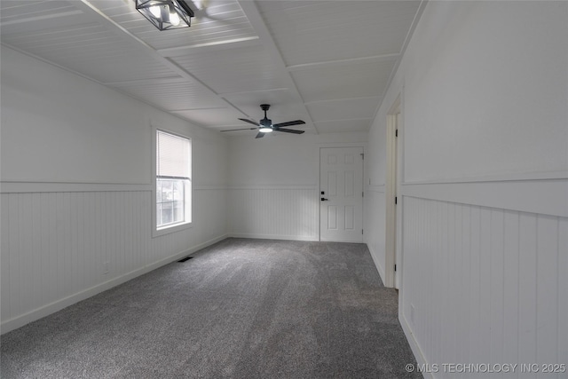 unfurnished room featuring carpet flooring and ceiling fan