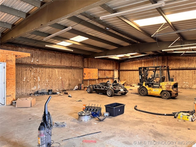 garage featuring wooden walls