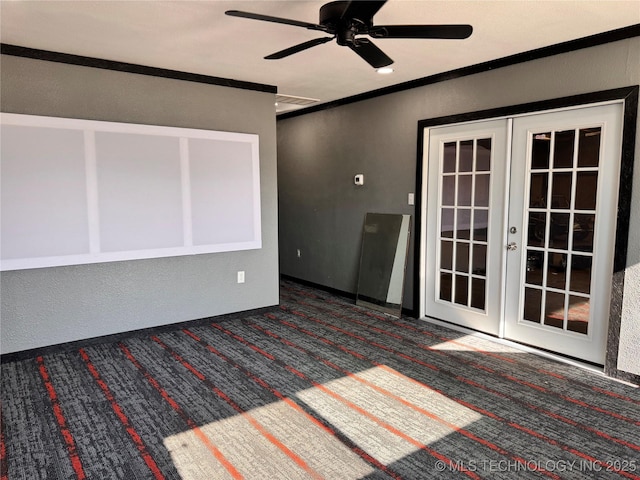 carpeted spare room featuring ceiling fan, french doors, and ornamental molding