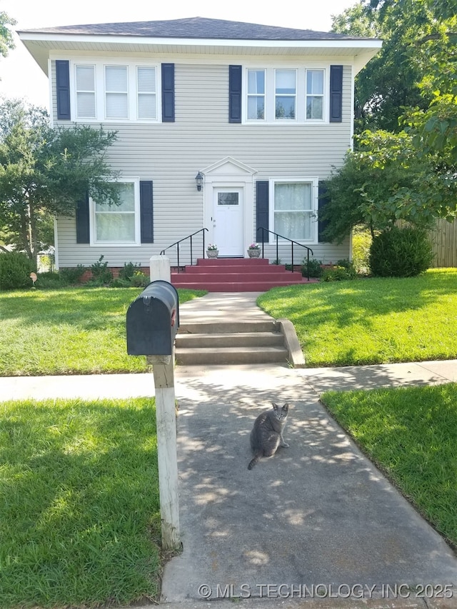 view of front of property with a front lawn