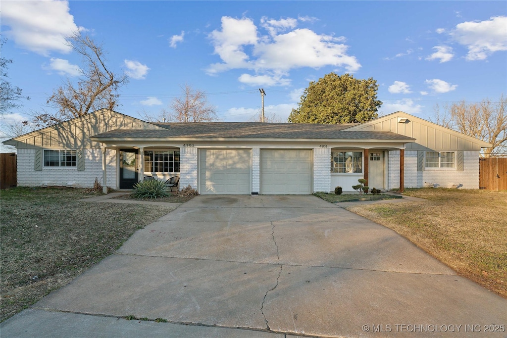 ranch-style home featuring a garage, a front yard, and a porch