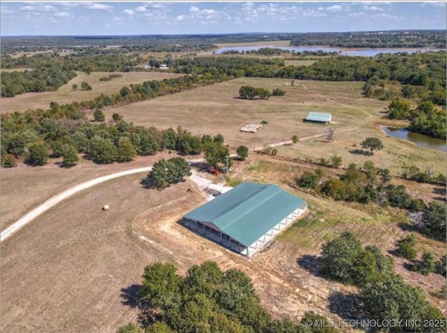 birds eye view of property featuring a rural view and a water view