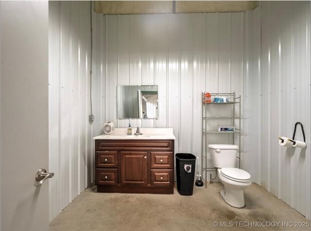 bathroom with toilet and vanity