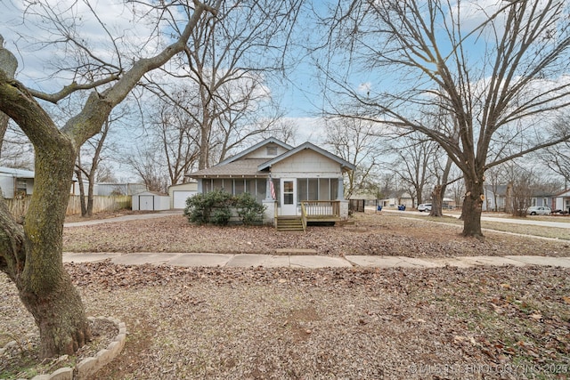 view of front of property featuring a garage and a porch